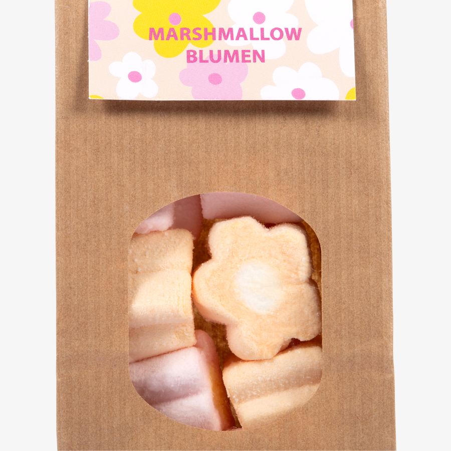 Detailansicht leckere Marshmallow-Blumen in einer Papiertüte mit Sichtfenster und Headerkarte